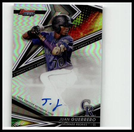 A vibrant holographic 2022 Bowmans Best baseball card featuring juan guerrero in purple colorado rockies uniform with autograph