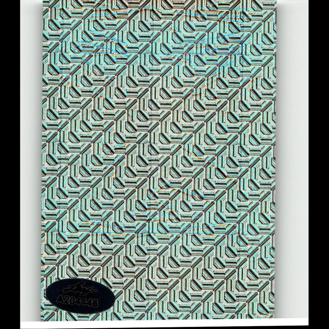 A teal and black geometric patterned notebook cover with a subtle metallic sheen.