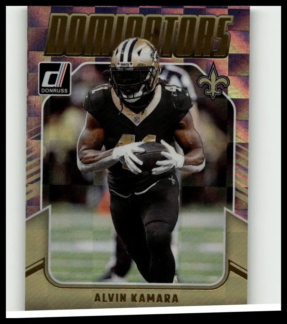 A gold and black 2024 donruss #25 alvin kamara dominators football trading card featuring kamara in a saints uniform