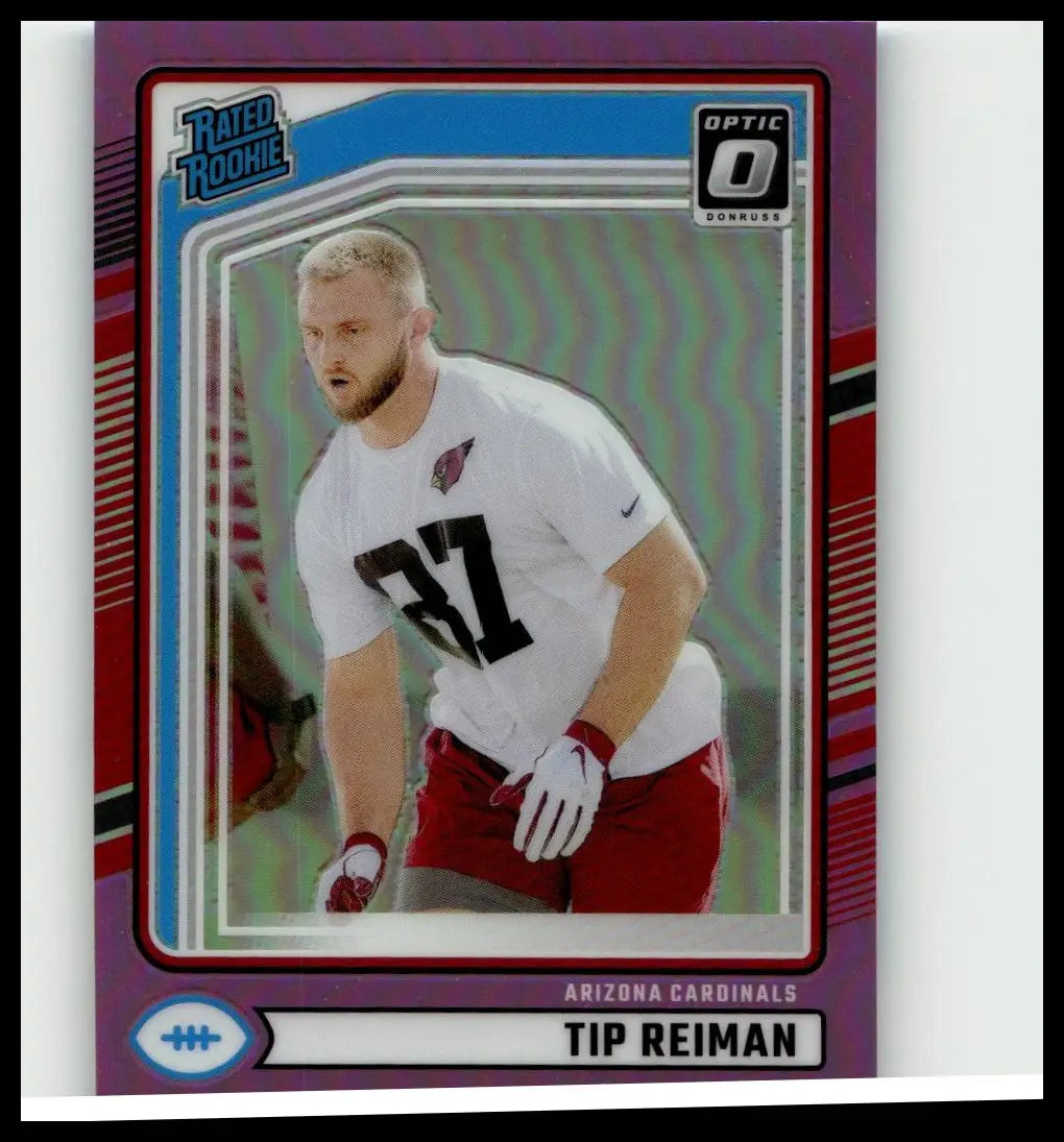 A purple and blue holographic 2024 donruss tip reiman optic rated football trading card in white jersey number 37
