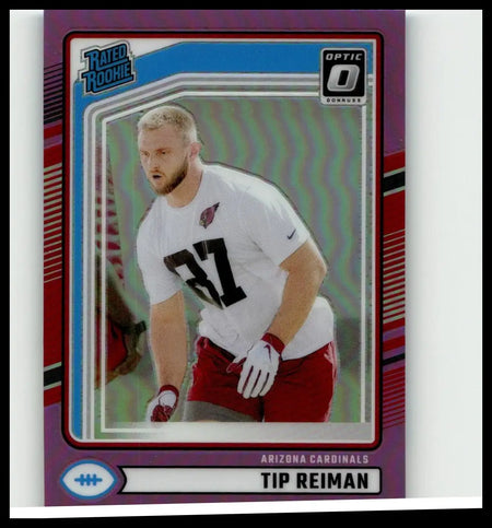 A purple and blue holographic 2024 donruss tip reiman optic rated football trading card in white jersey number 37