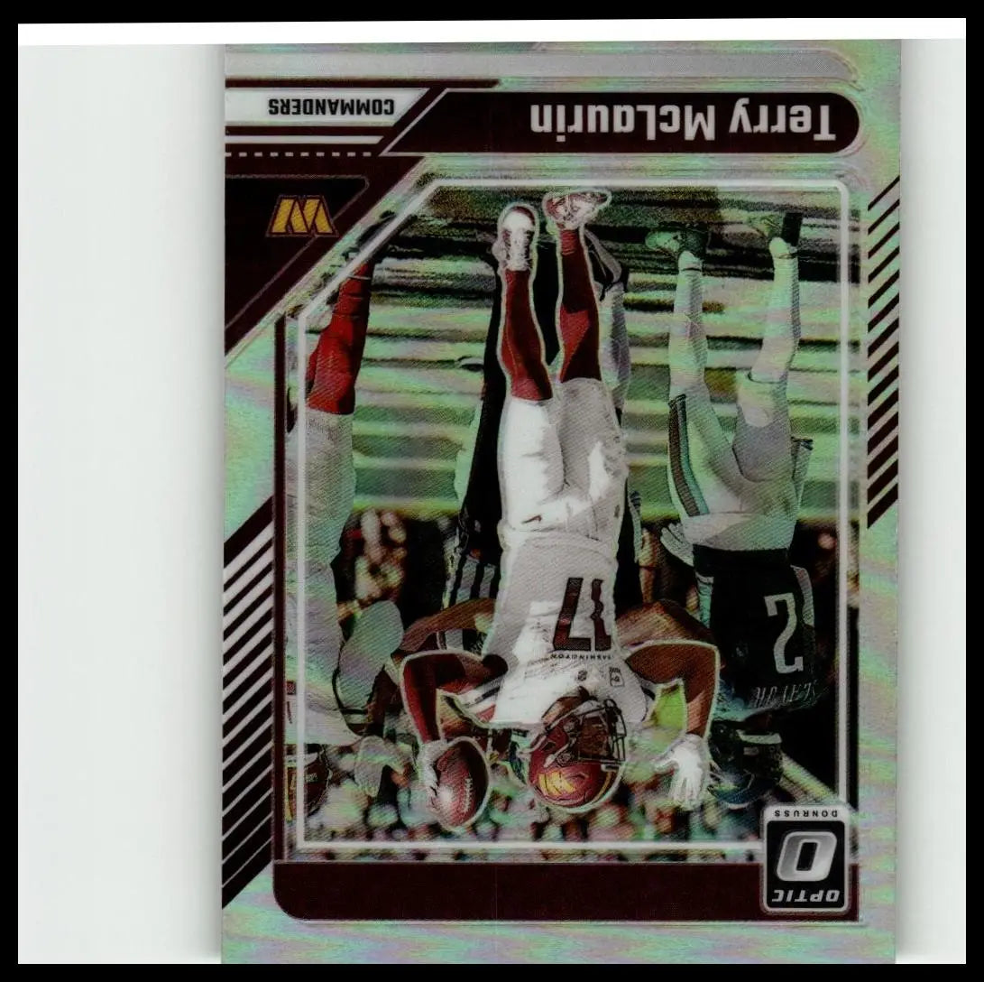 A shimmering holographic 2024 Donruss Optic #196 terry mclaurin football trading card featuring mclaurin in a white and maroon jersey