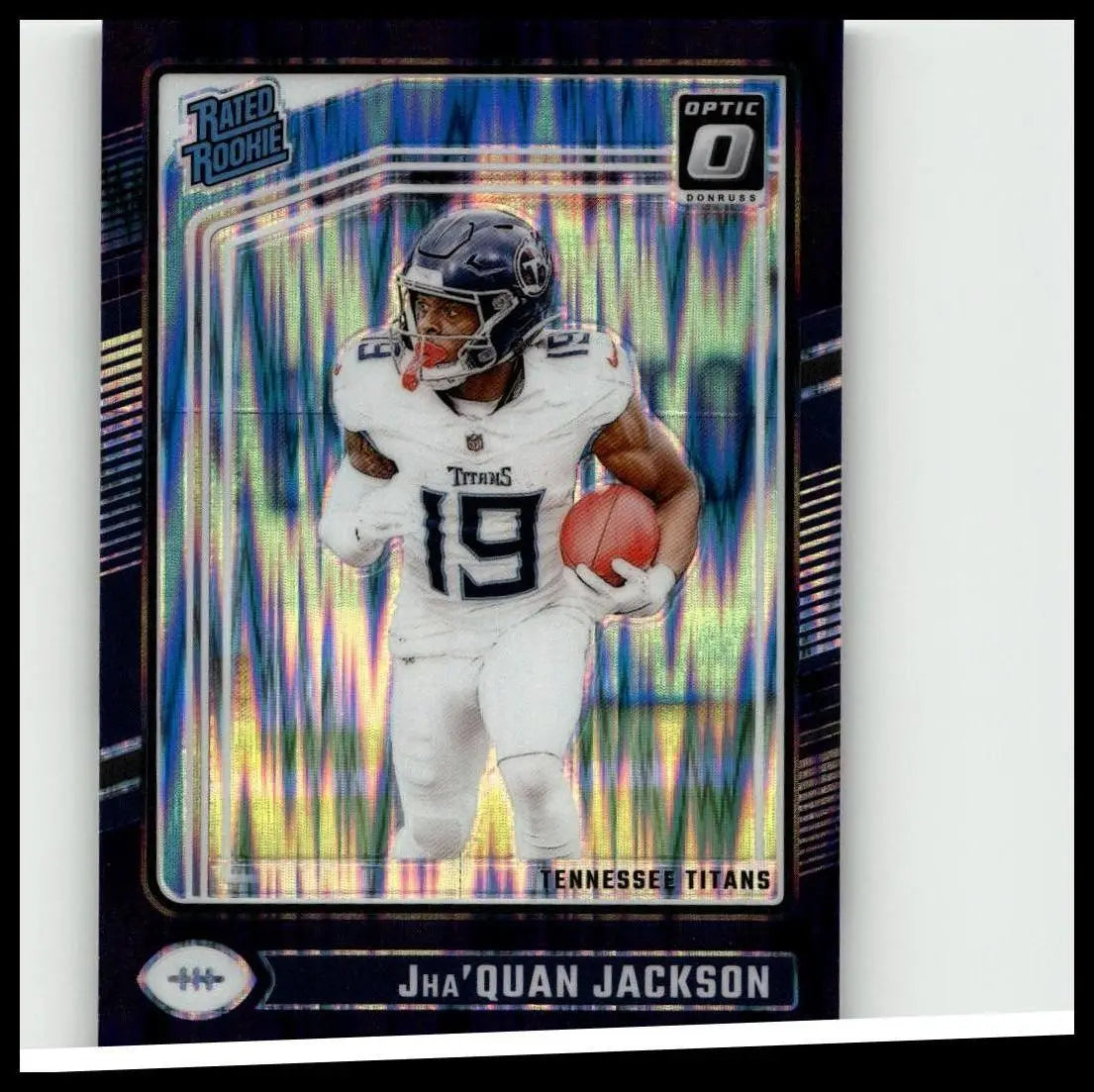A vibrant blue and silver holographic donruss optic football card featuring jha’quan jackson in tennessee titans uniform