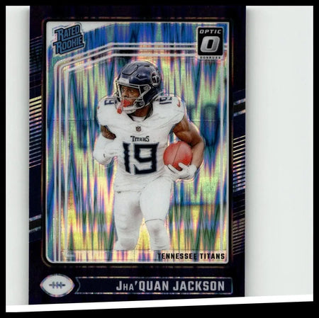 A vibrant blue and silver holographic donruss optic football card featuring jha’quan jackson in tennessee titans uniform