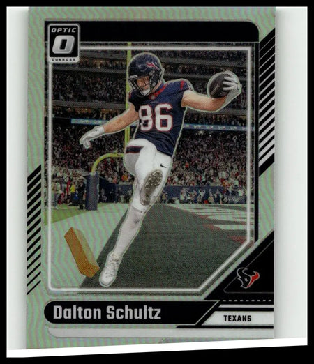 2024 Donruss Optic #80 Dalton Schultz holo football card showing Schultz in navy blue Houston Texans uniform mid-stride
