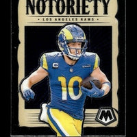 Blue and yellow los angeles rams football jersey with the number 10, worn by cooper kupp on a collectible trading card.