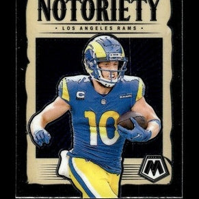 Blue and yellow los angeles rams football jersey with the number 10, worn by cooper kupp on a collectible trading card.