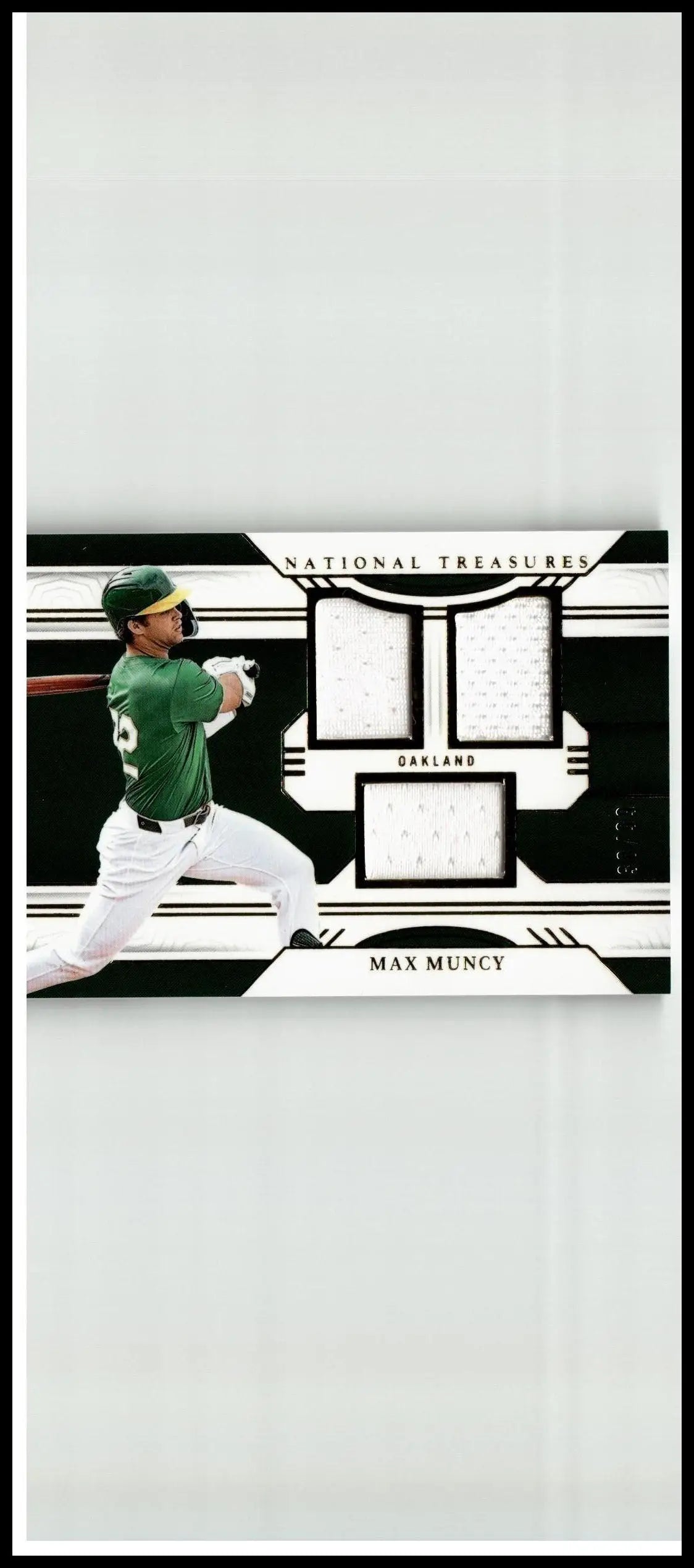 Back of a green and white baseball jersey with black trim featuring number 6 from max muncy game panini national treasures