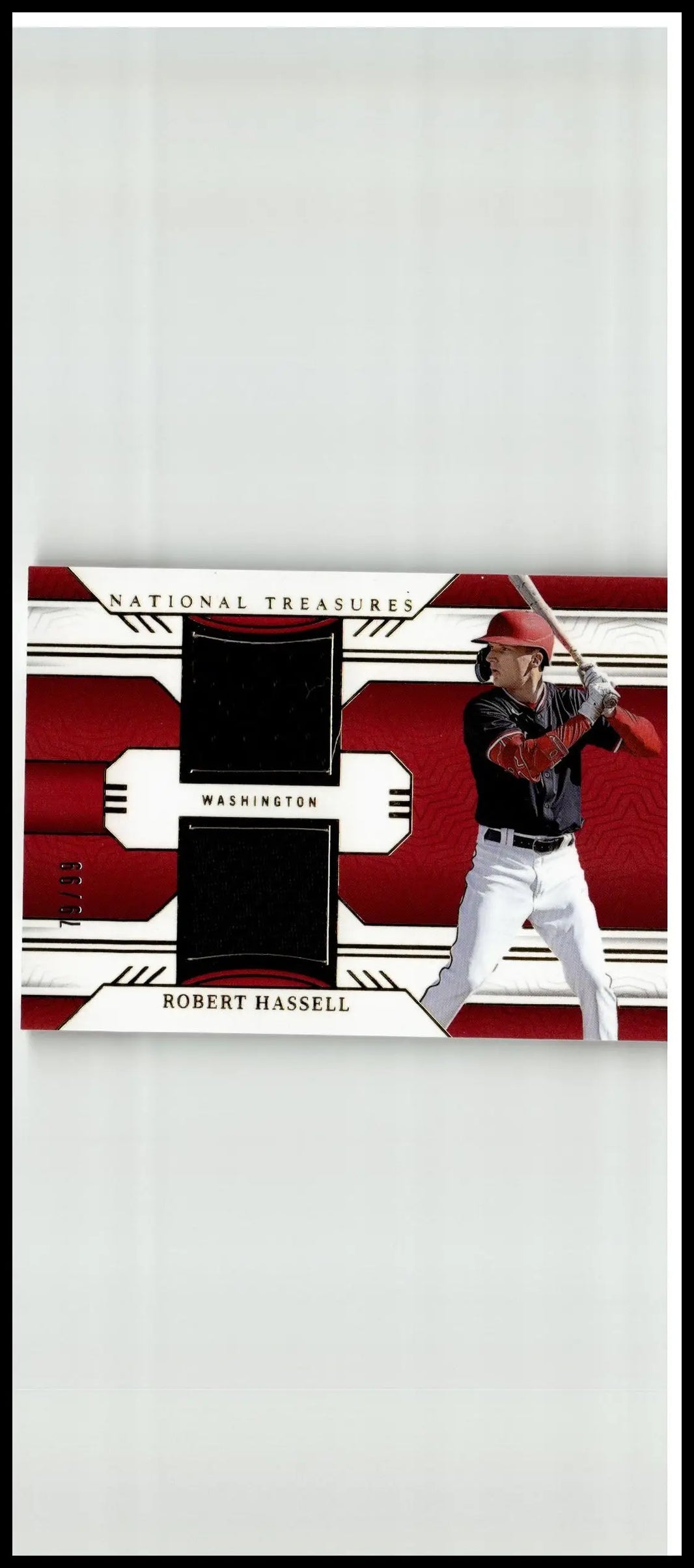 Red and white robert hassell panini national treasures baseball card featuring black fabric patches in batting stance