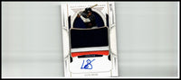 White baseball trading card with black and red design featuring autograph of luis baez from panini national treasures