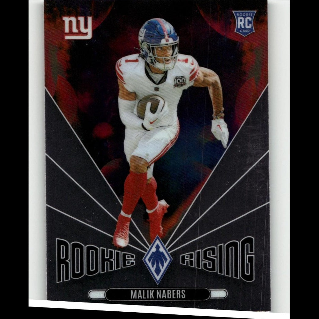 New york giants rookie football card featuring malik nabers in his white and red uniform with blue helmet, holding a brown football.