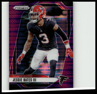 A vibrant purple and pink 2024 panini prizm football trading card featuring jessie bates iii in falcons uniform