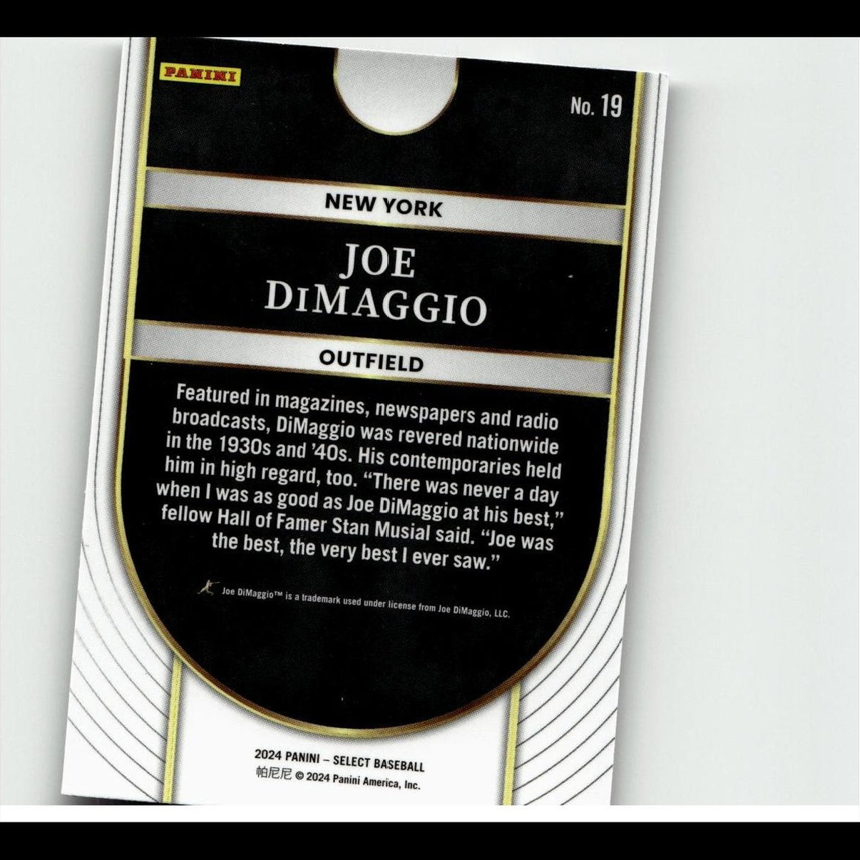 Black and gold baseball trading card featuring joe dimaggio, with white text on a glossy surface.