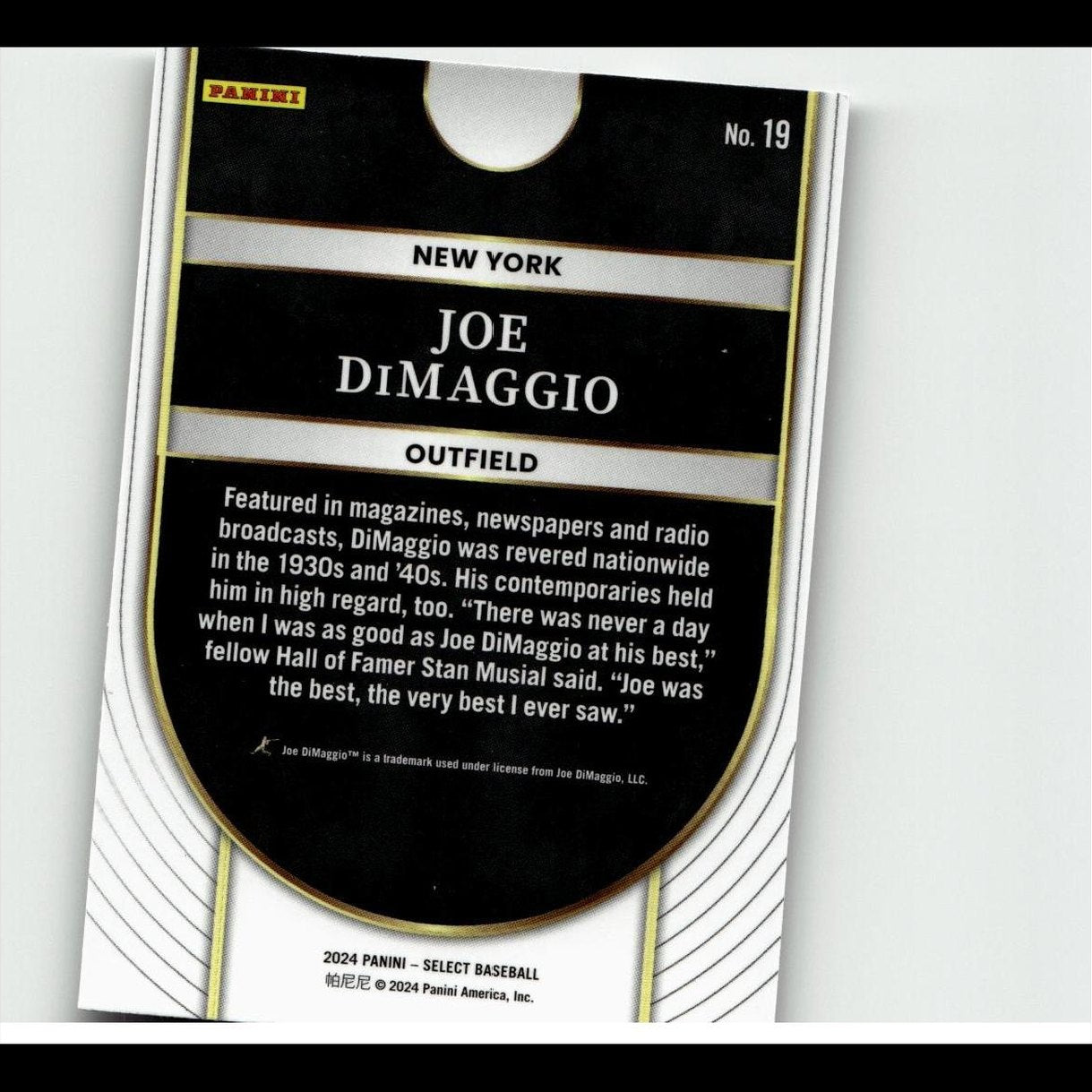 Black and gold baseball trading card featuring joe dimaggio, with white text on a glossy surface.