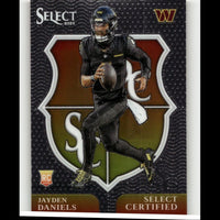 Black football trading card featuring jayden daniels in a black uniform with yellow accents, holding a brown football.