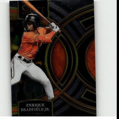 Orange and white baseball jersey with black helmet, worn by enrique bradfield jr.