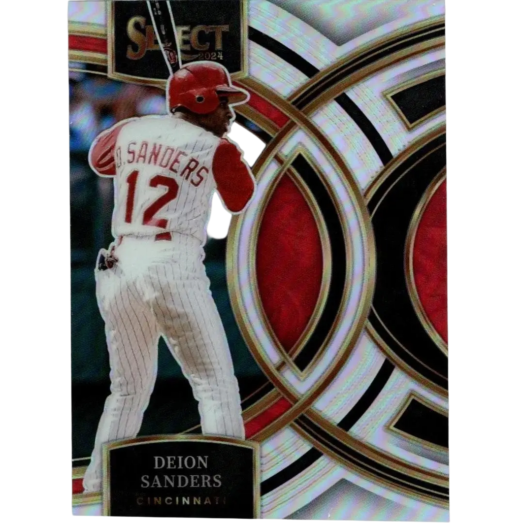 A 2024 select baseball trading card featuring deion sanders in a white pinstripe uniform with red accents and helmet, set against an ornate silver, black, and red geometric background.