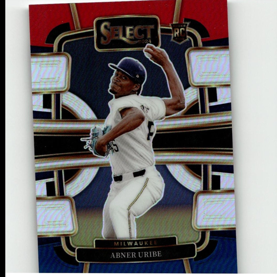 A 2024 select baseball trading card featuring abner uribe in a white milwaukee brewers uniform with black accents, captured mid-pitch against a red and gold holographic background.