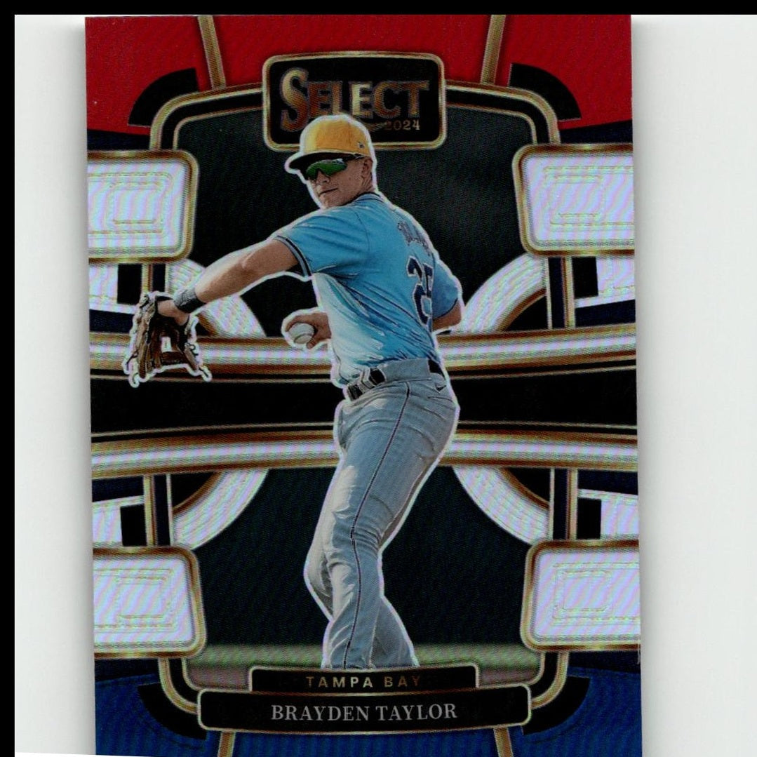 2024 select baseball trading card featuring brayden taylor in a light blue tampa bay rays jersey and gray pants, wearing a yellow cap with green sunglasses.