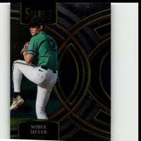 A glossy black and gold baseball trading card featuring noble meyer in a green jersey and white pants, with the ’select’ brand logo at the top.