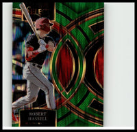 A vibrant green and red holographic robert hassell green flash baseball card from 2024 panini select #98 featuring hassell in batting stance