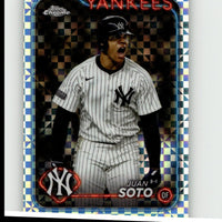 A shiny, chrome-bordered baseball trading card featuring juan soto in a white pinstripe yankees uniform with black accents and the under armour logo.