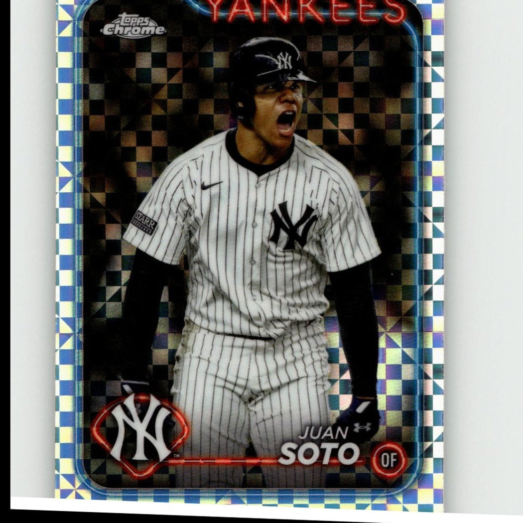 A shiny, chrome-bordered baseball trading card featuring juan soto in a white pinstripe yankees uniform with black accents and the under armour logo.