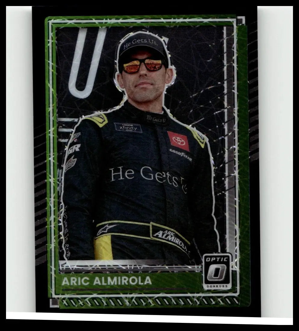 Green-framed 2025 Donruss #36 aric almirola optic black velocity trading card featuring almirola in black and yellow suit
