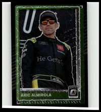 Green-framed 2025 Donruss #36 aric almirola optic black velocity trading card featuring almirola in black and yellow suit
