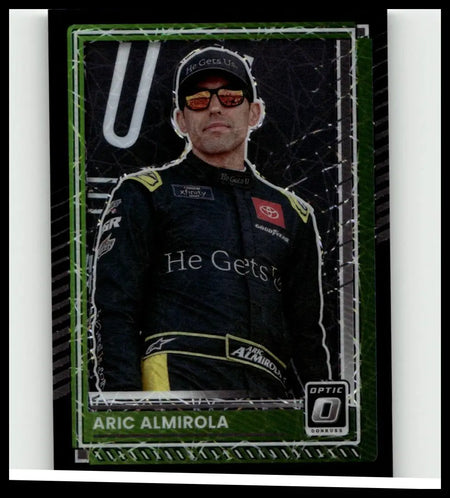 Green-framed 2025 Donruss #36 aric almirola optic black velocity trading card featuring almirola in black and yellow suit
