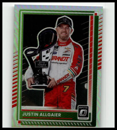 Justin Allgaier in red and white racing suit holding black trophy on 2025 Donruss #5 Justin Allgaier Optic Holo card
