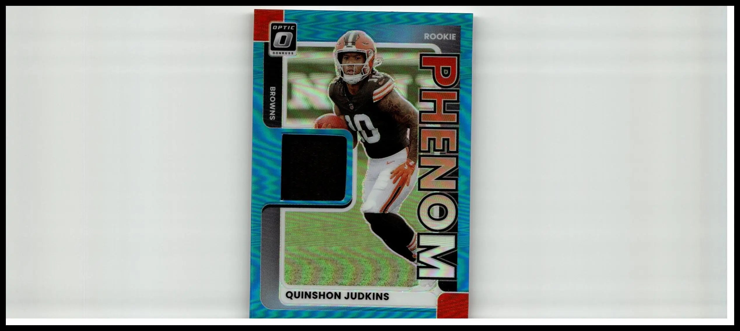 Blue and red phenom rookie trading card featuring quinshon judkins in brown and white uniform with optic 0 series logo