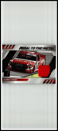Red and white Toyota NASCAR race car trading card featuring driver Corey Heim pedal to the metal materials red limited edition