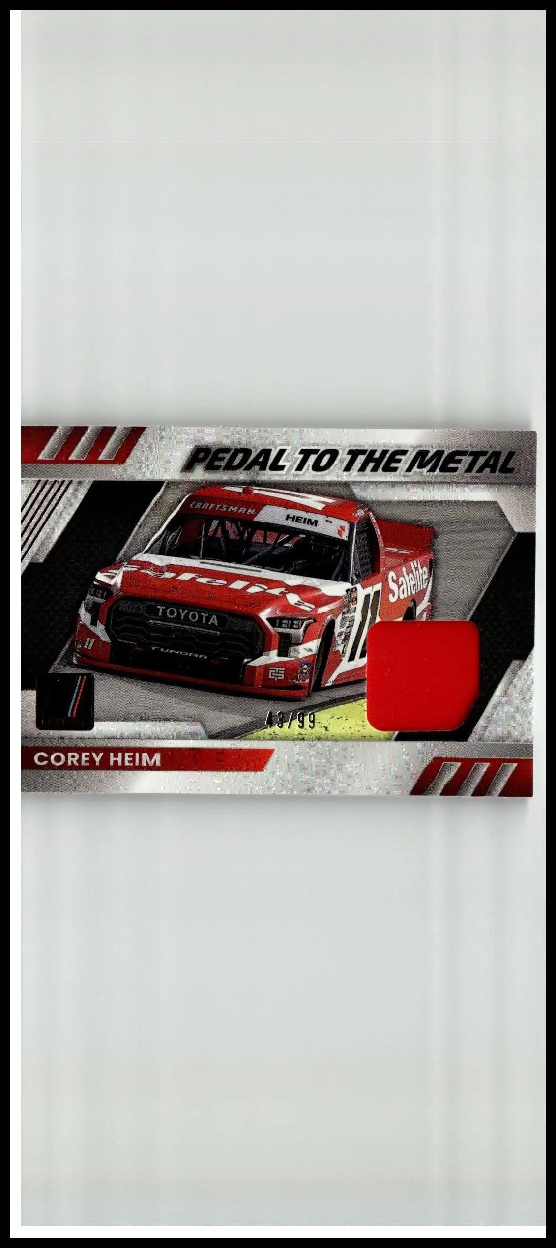 Red and white Toyota NASCAR race car trading card featuring driver Corey Heim pedal to the metal materials red limited edition