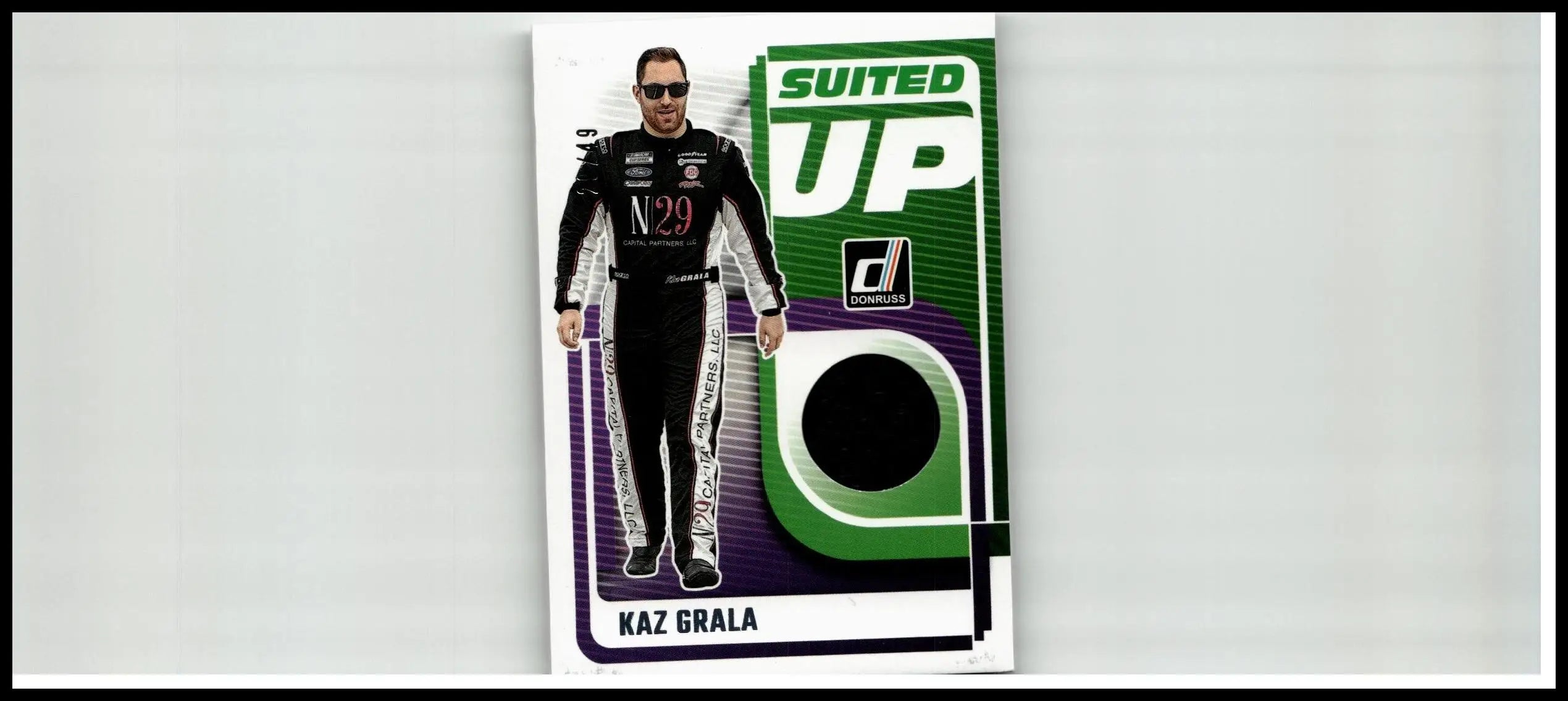 Black and white racing suit with silver accents featuring the number 29 and n logo for kaz grala suited collection