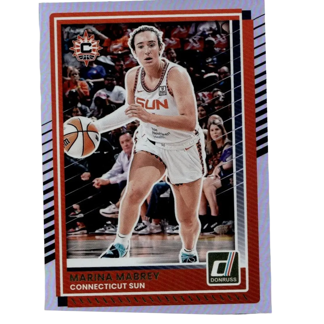 A red-bordered 2025 donruss wnba marina mabrey holo trading card showing marina mabrey in a white connecticut sun jersey holding a basketball
