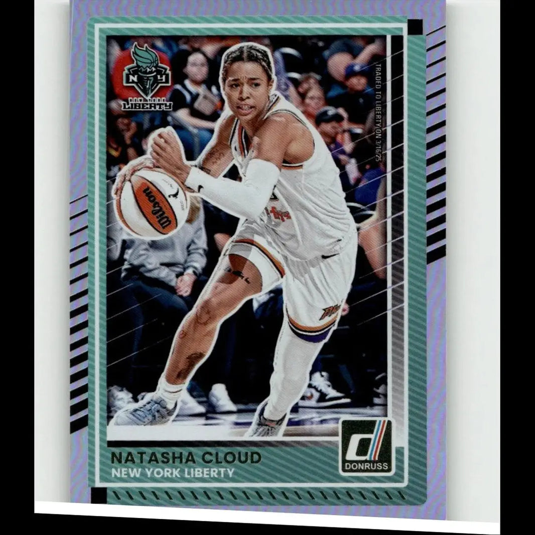 A vibrant purple and teal bordered 2025 Donruss WNBA Natasha Cloud holo card in New York Liberty jersey holding basketball