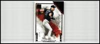 Black and white 2025 panini impeccable randy johnson silver baseball card featuring dynamic pitching pose with red splatter