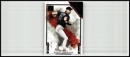 Black and white 2025 panini impeccable randy johnson silver baseball card featuring dynamic pitching pose with red splatter