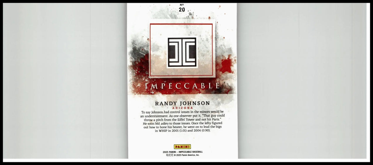 2025 panini impeccable randy johnson silver baseball card with black and white logo on textured gray background with red splatter