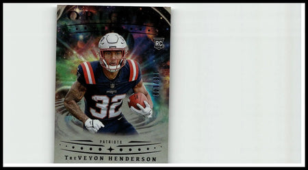 This collectible panini origins football card features treveyon henderson in his navy blue patriots jersey 32