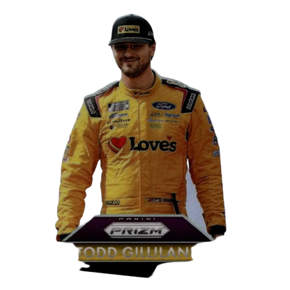 Yellow racing suit with black and red sponsor logos and heart-shaped loves emblem in 2025 panini prizm todd gilliland purple card