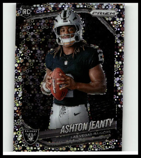 Silver and black panini prizm 2025 rookie card featuring las vegas raiders quarterback ashton jeanty holding football