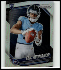 2025 panini prizm silver rookie card #440 featuring elic ayomanor in tennessee titans uniform holding orange football