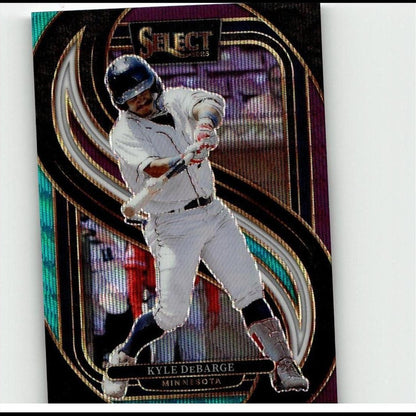 A glossy, iridescent baseball trading card featuring kyle debarge in a white uniform and blue helmet mid-swing.