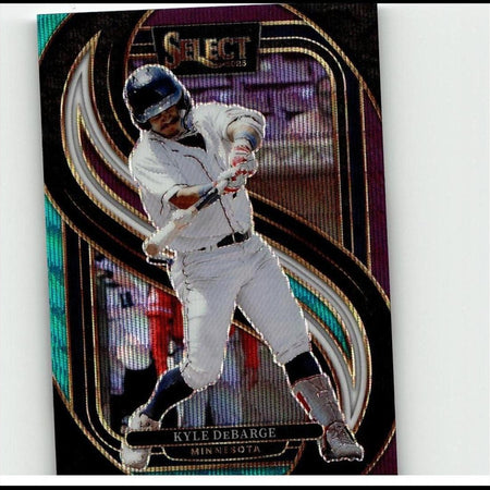 A glossy, iridescent baseball trading card featuring kyle debarge in a white uniform and blue helmet mid-swing.