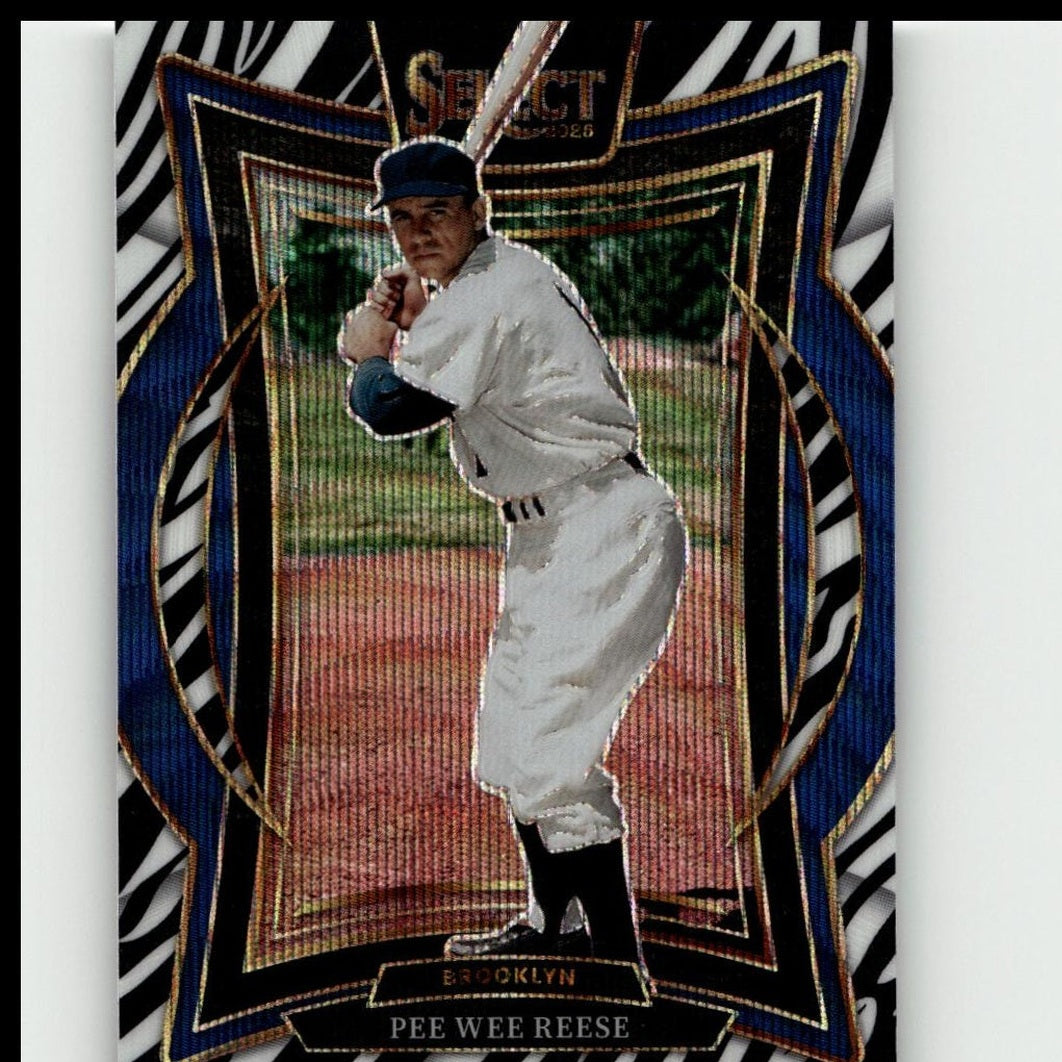 A vintage baseball trading card featuring pee wee reese in a white brooklyn uniform with black accents, set against an ornate blue and gold zebra-striped border.