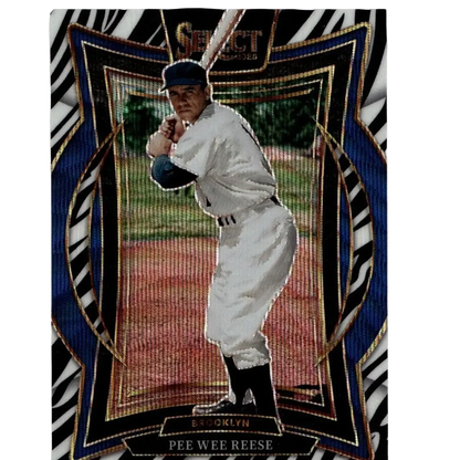 A vintage baseball trading card featuring pee wee reese in a white brooklyn uniform with black accents, set against an ornate blue and gold zebra-striped border.