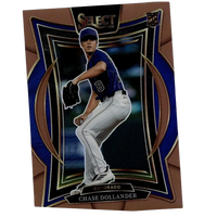 Bronze and blue framed baseball trading card featuring chase dollander in a colorado rockies uniform.