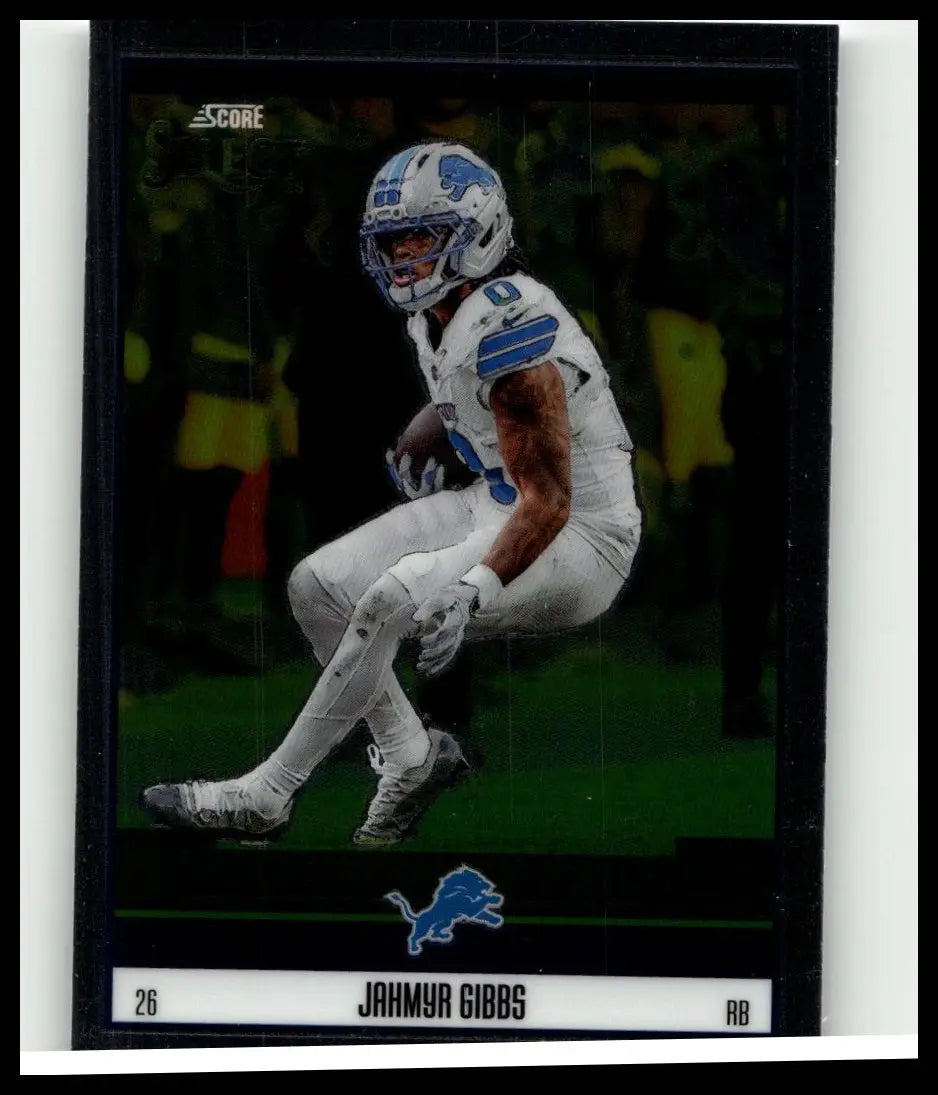 A black-bordered 2025 panini select #4 jahmyr gibbs score select football card in detroit lions white and blue uniform